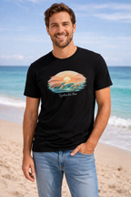 Man wearing beach themed turtle t-shirt near ocean, tropical vacation clothing for men